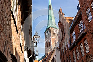 Scenic view old narrow european german Lubeck town with red brick ancient houses vintage iron stained glass lamp lantern