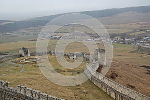 Scenic view of old stone european castle with grey fog on background