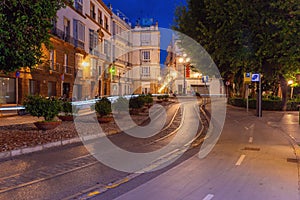 Scenic view of an old street in Cadiz at night.