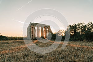 Scenic view of one of the pillars of Aqua Claudia in Rome with a sunset in the background