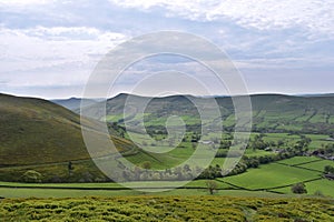 Scenic view over fields to mountain ridge