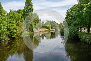 Scenic view over nature relfections in the River Durme around Lokeren, Belgium