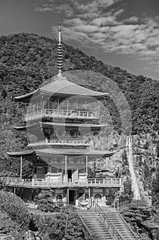 Pagoda of Seiganto-ji Temple with Nachi no Taki waterfall in background at Nachi Katsuura, Wakayama, Japan