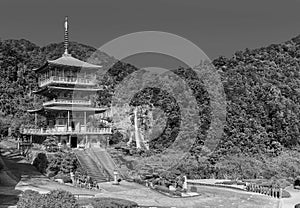 Scenic view of pagoda of Seiganto-ji Temple with Nachi no Taki waterfall in background at Nachi Katsuura, Wakayama, Japan