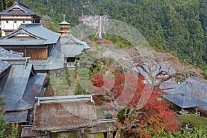 Scenic view of pagoda of Seiganto-ji Temple with Nachi no Taki waterfall in background at Nachi Katsuura, Wakayama, Japan