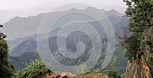 Scenic view of palani hills from guna cave view point at kodaikanal photo
