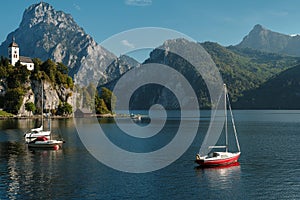 Scenic view on the perched Johannesberg Chapel in Austria, surrounded by mountains and the lake Traunsee