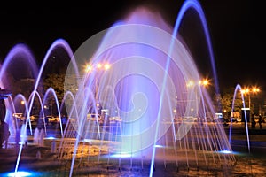 The scenic view of picturesque fountain with colorful illumination at night, Ukraine Dnepropetrovsk city, Dnipro . Creative water