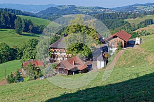 Scenic view of a picturesque landscape with mountain forests and traditional houses. Black Forest, Germany