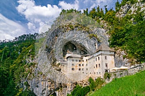 Scenic view of Predjama castle near Postojna, Slovenia at sunny summer day