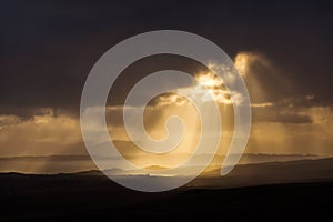 Scenic view of Quiraing mountains in Isle of Skye, Scottish highlands, United Kingdom. Sunrise time with colourful an rayini