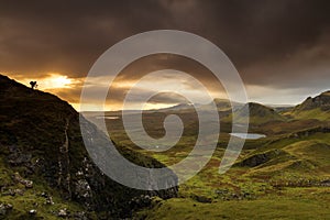 Scenic view of Quiraing mountains in Isle of Skye, Scottish highlands, United Kingdom. Sunrise time with colourful an rayini