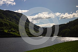 Scenic view of a river and green mountain forests at Narrow Fjord in Vestland, Norway