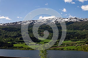 Scenic view of a river and green mountain forests at Narrow Fjord in Vestland, Norway