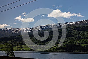 Scenic view of a river and green mountain forests at Narrow Fjord in Vestland, Norway