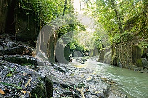 scenic view of river, rocky formations and green plants near Kanto Lampo Waterfall,