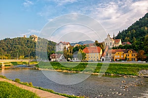 Scenic view on river Savinja, Capuchin monastery, houses in Breg and castle hill in Celje, Slovenia