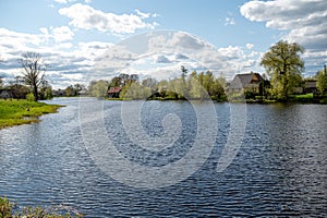 Scenic view of the river and village in spring