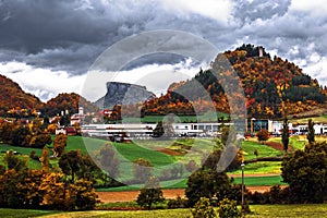 Scenic view of rock formation against a autumn foliage forest, countryside and cloudy sky, Pietra Di Bismantova, Felina, Reggio