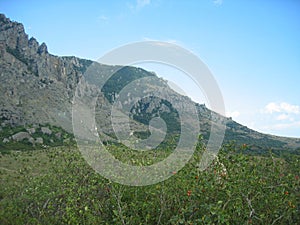 Scenic view of rocky mountains and blue sky on a clear autumn day at the foot of Mount Dimerdzhi, Crimea