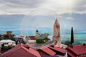 Scenic view on a roofs of ancient buildings of Sighnaghi, Georgia. Alazani Valley and Caucasus mountain range photo