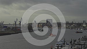 Scenic view row big cargo container ship loading Hamburg city port harbour seaport cranes. View of seaport in Hamburg on