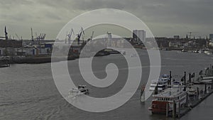 Scenic view row big cargo container ship loading Hamburg city port harbour seaport cranes. View of seaport in Hamburg on