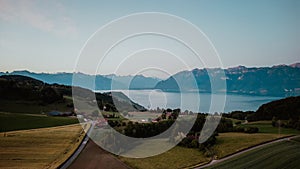 Scenic view of rural houses on green hills near Lake Geneva in Lausanne, Switzerland