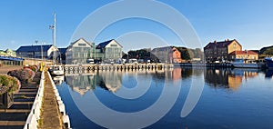 Scenic view of sailboats and yachts docked alongside a waterfront