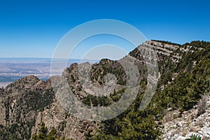Scenic view of Sandia Peak in Albuquerque, New Mexico, in blue sky background
