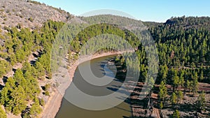 Scenic view of Santa Fe's Lake near Williams, Arizona, USA. Aerial view from drone of calm reservoir with red