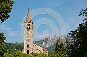 Scenic view of Santo Stefano church in Tesserete and Denti della Vecchia mountain range photo