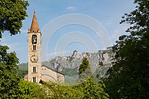 Scenic view of Santo Stefano church in Tesserete and Denti della Vecchia mountain range photo