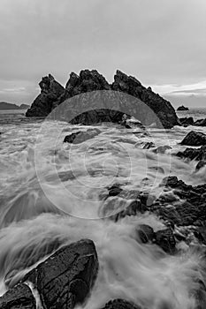 Scenic view of the seascape in Gigi Hiu Lampung, Indonesia in grayscale