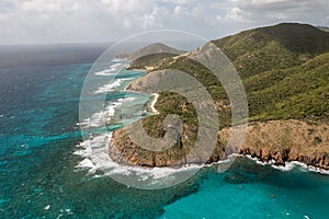 Scenic view of the serene, blue ocean waters and rocky shorelines from Rendezvous Beach, Antigua