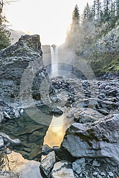 Scenic view of Snoqualmie falls with golden fog when sunrise in winter season,Washington,USA