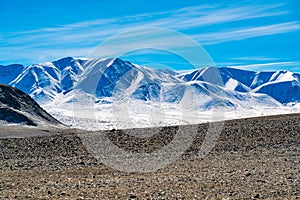 Scenic view of snow covered mountain in summe