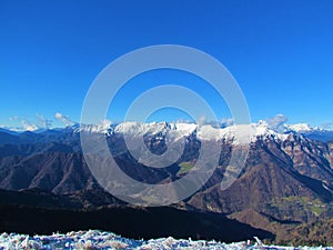 Scenic view of snow covered peaks of the mountains of the Julian alps photo