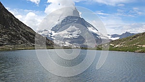 Scenic view on snowy Matterhorn peak and lake Stellisee, Zermatt, Switzerland