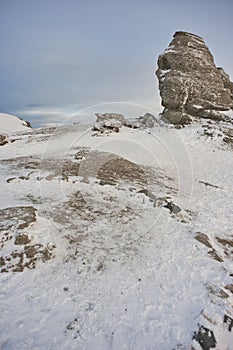 Scenic view of the Sphinx of Romania in the Bucegi mounatins during winter time