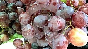 Scenic view of stocked fruits of red grapes