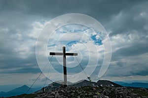 Petzen - Scenic view of summit cross of mountain peak Feistritzer Spitze (Hochpetzen), Karawanks, Carinthia, Austria photo