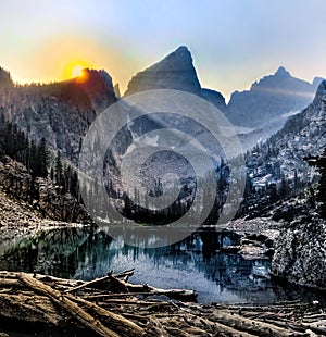 Scenic view of a sunrise over Delta Lake at the Grand Teton National Park in Wyoming, USA