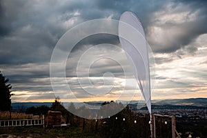 Scenic view of the sunset in cloudy sky over the town