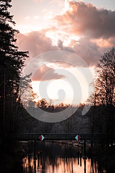 Scenic view of sunset over a calm lake and forest