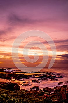 Scenic view of the sunset over a rocky coast