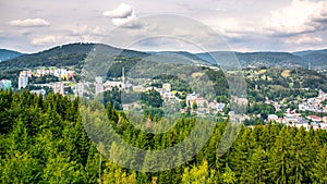 Scenic view of Tanvald and spruce forests of hilly landscape around Tanvaldsky Spicak mountain, Jizera Mountains, Czech