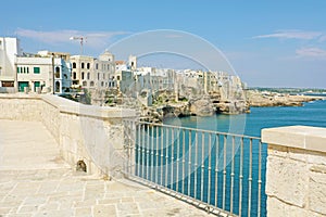 Scenic view from terrace of Mediterranean sea and cliffs of Polignano a Mare town, Apulia, Italy