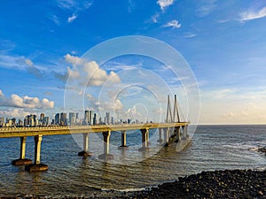 Scenic view to Bandra Worli Sea Link bridge during sunset with Arabian sea around under blue sky