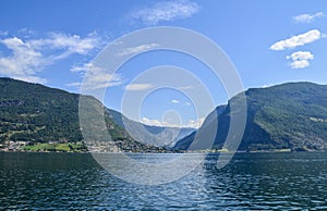Scenic view to village at end of Aurlandsfjorden on west coast in early summer. Flam, Aurland, Norway, Scandinavia